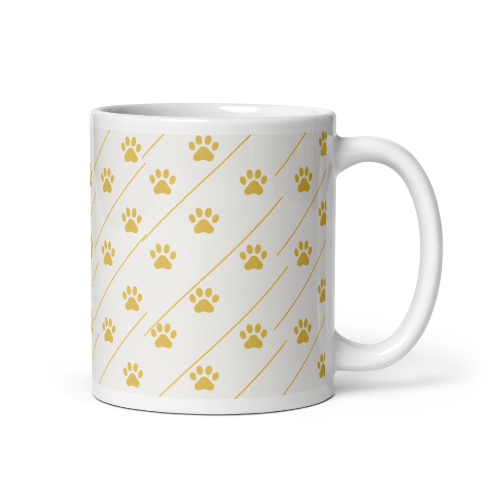 Ivory Whisper mug with gold paw print pattern on a white background