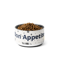 Dog food bowl with 'Bon Appetit' text on a white background