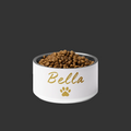 White pet bowl with 'Bella' and a paw print, filled with pet food on a white background