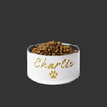 ivory whisper  pet bowl with 'Charlie' and a paw print, filled with pet food on a white background