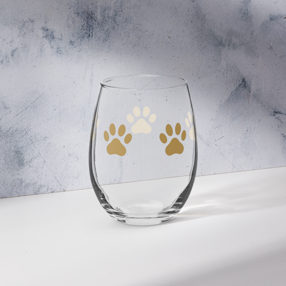 Clear glass with paw prints on a gray surface