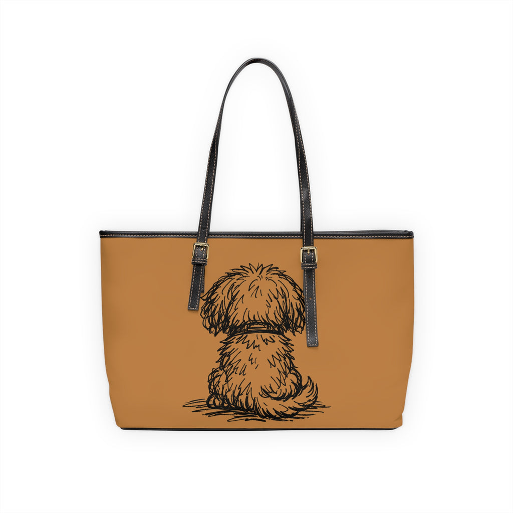 Tan tote bag with a black dog illustration on a white background