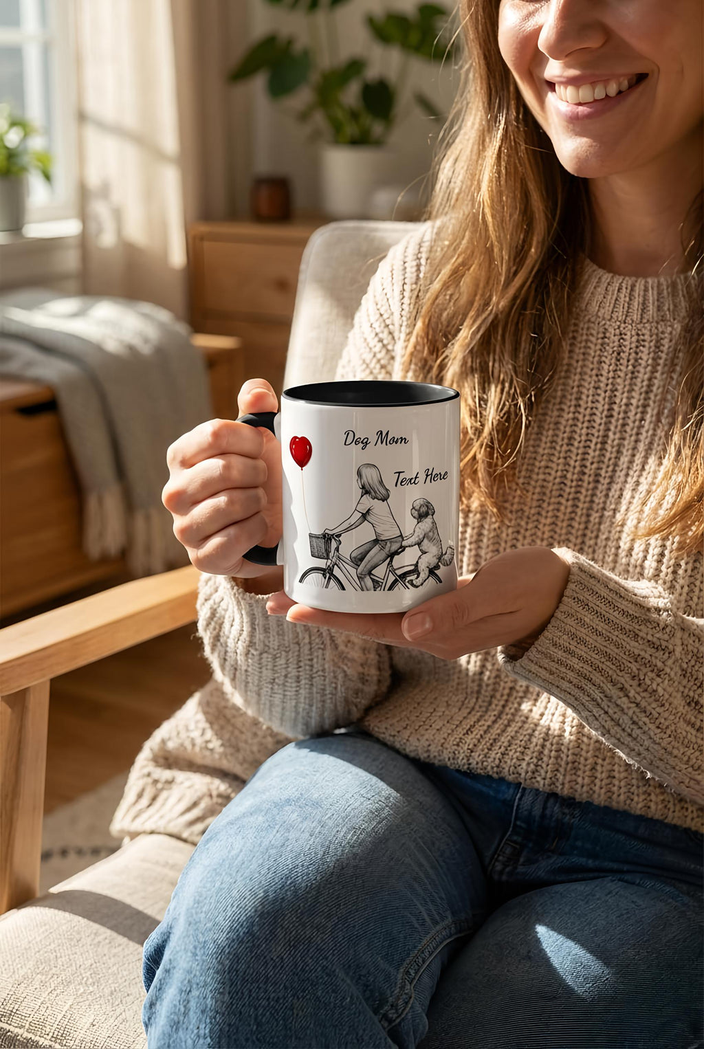 Woman holding a mug with a personalized design in a cozy living room.