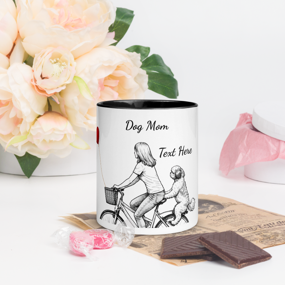 Mug with 'Dog Mom' text and illustration of a woman and dog on a bike, surrounded by flowers and chocolates.