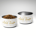 Two ivory pet bowls with gold text and designs on a light gray background