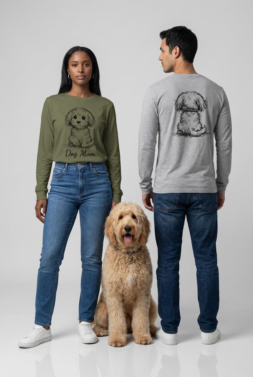 Two people wearing sweatshirts with dog illustrations and a dog sitting between them on a white background