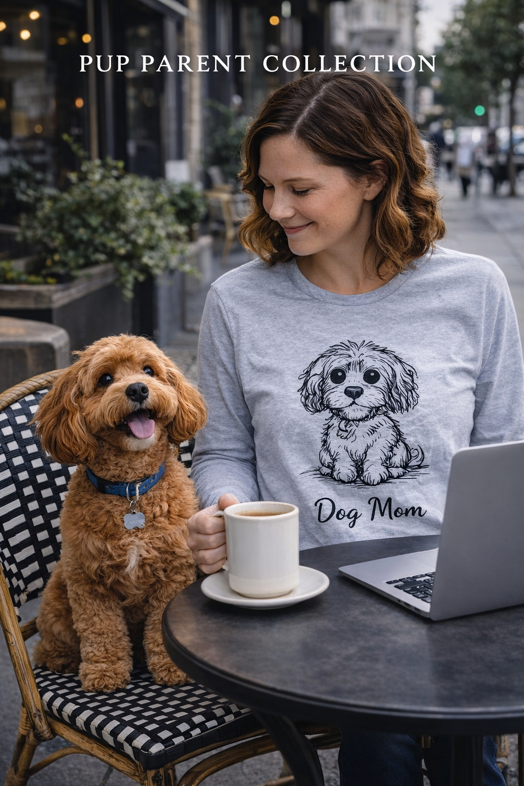 Woman wearing a 'Dog Mom' shirt sitting at an outdoor cafe with a dog.