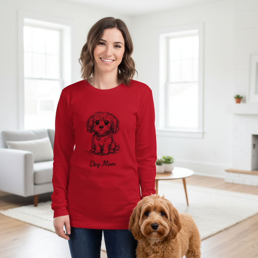 Woman wearing a red sweatshirt with a dog design and 'Dog Mom' text, standing next to a dog in a living room.