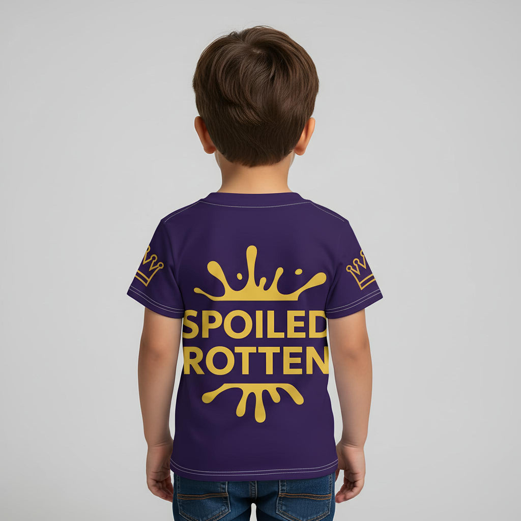 Child wearing a blue t-shirt with 'Spoiled Rotten' in gold text on a plain background